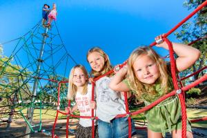a group of three girls playing on an adventure park at Reflections Jimmys Beach - Holiday Park in Hawks Nest