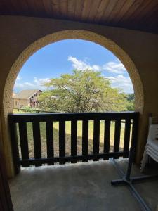 an arched window with a bench on a balcony at Laye Station - Appartement pieds des pistes in Laye
