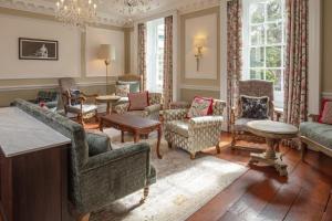 a living room with couches and chairs at The Manor House at Norton Park in Winchester