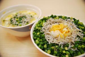 a bowl of food with peas and cheese and a bowl of soup at Sotetsu Fresa Inn Fujisawaeki Minamiguchi in Fujisawa