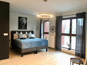 Ένα ή περισσότερα κρεβάτια σε δωμάτιο στο Bookowska Dal Cuore Apartment