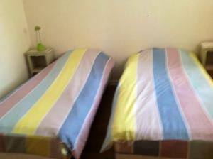 Postel nebo postele na pokoji v ubytování Appartement confortable à Saint-Martin, 60 m², jardin spacieux