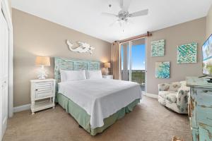 a bedroom with a bed and a window at La Playa 1202 in Perdido Key