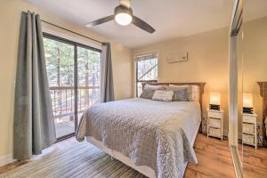 a bedroom with a bed and a large window at Cozy Incline Village Condo Less Than 3 Mi to Lake Tahoe! in Incline Village
