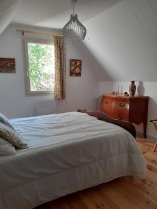 Postel nebo postele na pokoji v ubytování La villa Le Petit Bois, près Rocamadour, Padirac
