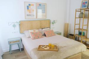 a bedroom with a bed with a tray on it at Bright and modern apartment in Bilbao city center in Bilbao