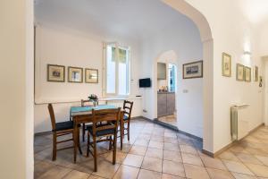 a dining room with a table and chairs at Terme Apartment in Florence