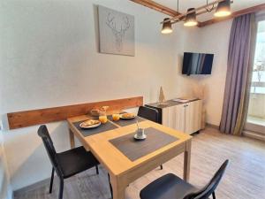 Televízia a/alebo spoločenská miestnosť v ubytovaní *Nouveau* Pied des pistes * Piscine ext. chauffée*