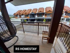 a balcony with a view of a house at RS Homestay in Sungai Petani