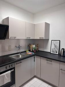 Kuchyň nebo kuchyňský kout v ubytování cozy Apartment mit Balkon I WLAN