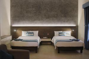 Tempat tidur dalam kamar di Hotel Casona Oaxaca