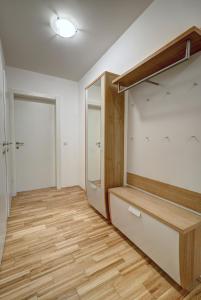 an empty room with a closet and wooden floors at Carin Deluxe II in Vienna