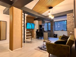 O zonă de relaxare la Penthouse luxury Predeal View