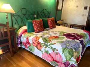 Postel nebo postele na pokoji v ubytování Hotel Doña Sancha