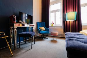 TV a/nebo společenská místnost v ubytování Boutique Hotel Rothenburger Hof