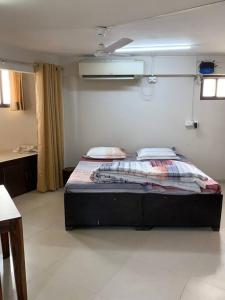 a bedroom with a bed in a room at Kamil’s Studio Apartment in Lucknow