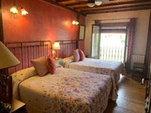 Postel nebo postele na pokoji v ubytování Hotel Doña Sancha