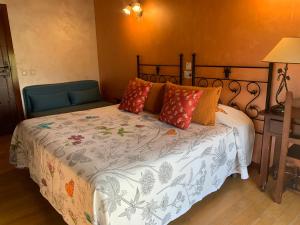 Postel nebo postele na pokoji v ubytování Hotel Doña Sancha