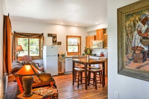 a kitchen with a table and a dining room at Columbia Falls Vacation Rental 10 Mi to Whitefish in Columbia Falls