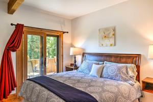 a bedroom with a bed and a balcony at Columbia Falls Vacation Rental 10 Mi to Whitefish in Columbia Falls