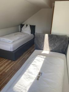 a small room with a bed and a mattressvisor at Ferienwohnung Siegen Eiserfeld 2 in Siegen