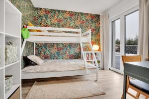 Postel nebo postele na pokoji v ubytování SKI Berg Klínovec