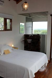 En eller flere senge i et værelse på El Observador del Tiempo