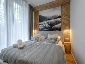 Posteľ alebo postele v izbe v ubytovaní VisitZakopane - Porto Apartment