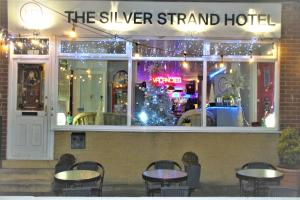 a restaurant with tables and chairs in front of it at MyRoomz Silver Strand Hotel in Blackpool