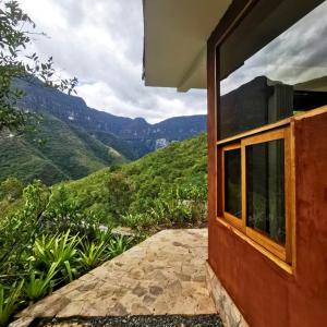a house with a view of the mountains at Goctamarca Lodge in Cocachimba
