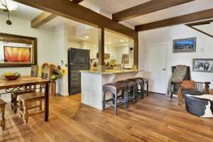 a kitchen with a counter and chairs and a table at 2180-Sunflowers and Cowboys home in Big Bear Lake