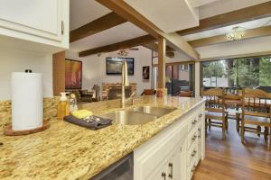 a kitchen with a sink and a dining room at 2180-Sunflowers and Cowboys home in Big Bear Lake