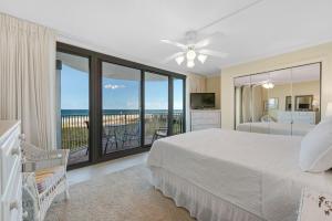a bedroom with a bed and a view of the ocean at Perdido Towers East 104 in Perdido Key +42 photos