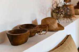 a pair of shoes and boots sitting on a shelf at Casa Moni con Vistas al Mar in Playa de Santiago