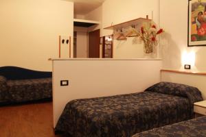 Letto o letti in una camera di Albergo Visconti