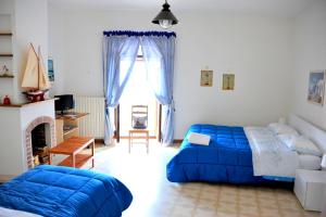 Un pat sau paturi într-o cameră la B&B La Muraglia
