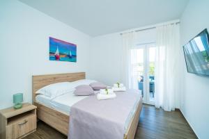 Posteľ alebo postele v izbe v ubytovaní Blue Bay Apartment