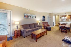 a living room with a couch and a table at Winterplace G101 in Ludlow