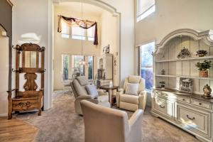 a living room with white furniture and a large window at Littleton Home with Patio - 8 Mi to Red Rocks in Littleton
