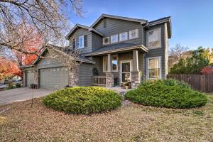 a gray house with a garage at Littleton Home with Patio - 8 Mi to Red Rocks in Littleton