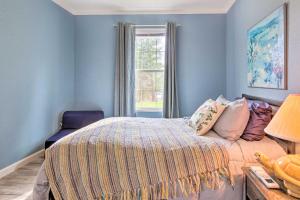 a blue bedroom with a bed and a window at Mountain-View Zirconia Home Walk to Lake Summit! in Zirconia +16 photos