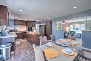 a kitchen and dining room with a table and chairs at Vibrant Sacramento Home with Yard and Patio! in Freeport