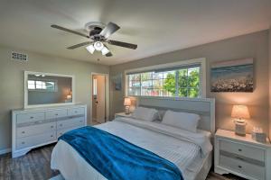 a bedroom with a bed and a ceiling fan at Vibrant Sacramento Home with Yard and Patio! in Freeport