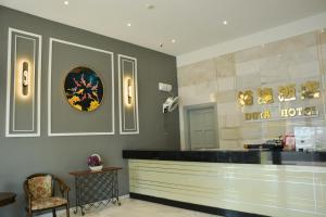 a restaurant with a counter and a mirror at DUTA HOTEL in Kuala Lumpur