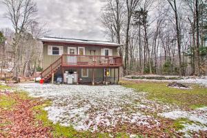 a large house with a deck on a yard at Cozy Killington Retreat about 5 Mi to Ski Resort in Killington