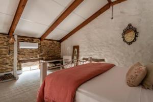 a bedroom with a large bed in a room at Randell's Mill - Adelaide Hills - Romantic Loft Stays in Gumeracha