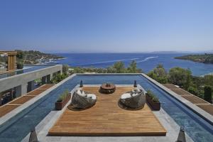 a house with a view of the ocean at Mandarin Oriental, Bodrum in Golturkbuku