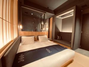 Postel nebo postele na pokoji v ubytování Hotel Zagakukan