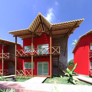 una casa rossa con tetto marrone di Chaleville Coqueiro 3201 - Luis Correia Piaui a Luis Correia