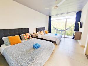 Postel nebo postele na pokoji v ubytování CasaMIA Hotel Boutique - Villeta + 37 fotografií